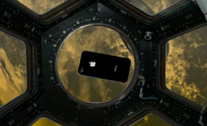 An iPhone floats in the International Space Station's cupola, in a promotional simulation by Odyssey Space Research.