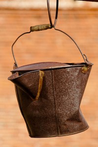 photo of an old rusty bucket