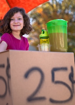 Girl running a lemonade stand