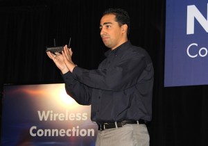 Netgear vice president David Henry shows off a router.