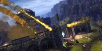 Trebuchet shots rain down on a stronghold under siege in Guild Wars 2's World vs. World mode.