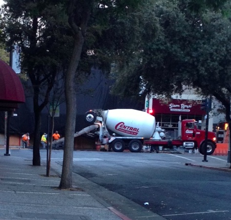 Workers pouring concrete at 7am Saturday outside what is likely Apple's next Palo Alto store