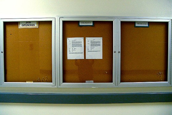 An empty bulletin board represents jobs that aren't there