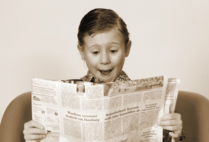 Little boy newpaper