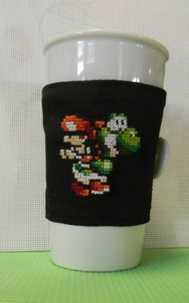 Cross Stitched Yoshi's Island w/Baby Mario Drink Cozy by pandakabobs