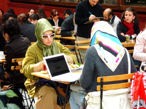 Two young Muslim women with a Macbook in Istanbul represent the growing sophistication of Turkey's e-commerce market.