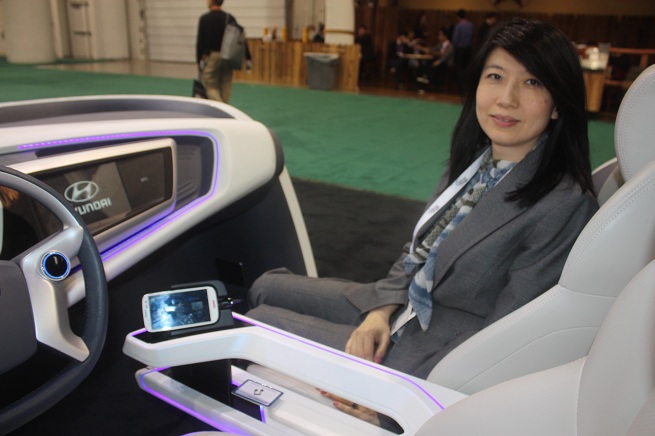 Judy Chen showed how your phone can be wired into your car display, which can mirror the image on the phone.