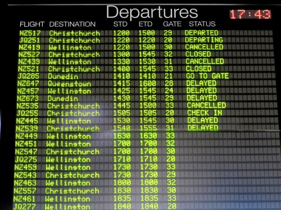 departures board showing many canceled flights