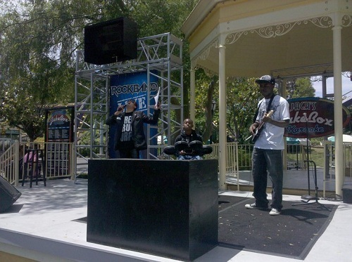 A rare sight of someone participating in Rock Band Live