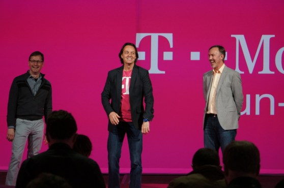 CEO John Legere alongside two other T-Mobile executives.