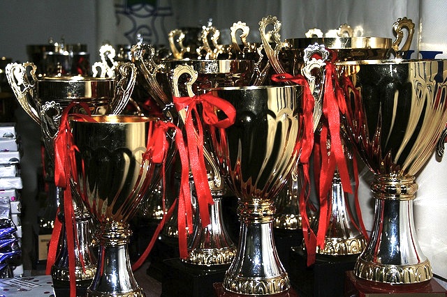A bunch of trophies on a table