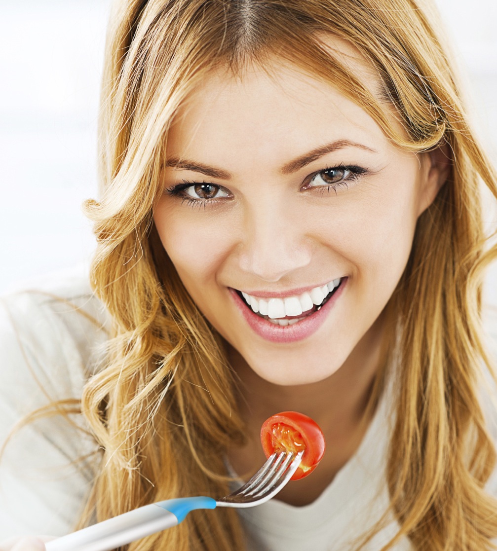 Close-up of a woman eating healthy food.