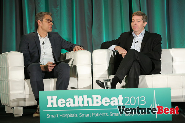 Premier Inc. vice president Sean Cassidy onstage at HealthBeat 2013, with Venturebeat's Matt Marshall
