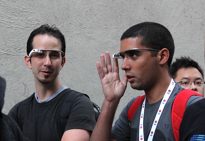 Two guys wearing Google Glass while waiting in line at Google I/O 2013