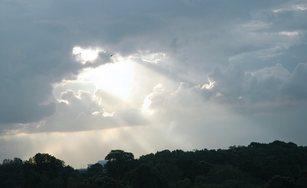 Photo of light shining through a cloud