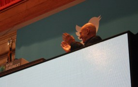 Patrick Stewart claps as the bell begins to ring