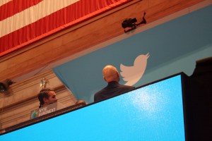 Patrick Stewart examines the Twitter logo as he stands next to Vivienne Harr, who helped him ring the opening bell.