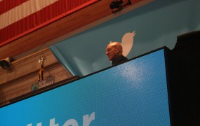 Patrick Stewart surveys the crowd before he and Vivienne Harr ring the opening bell