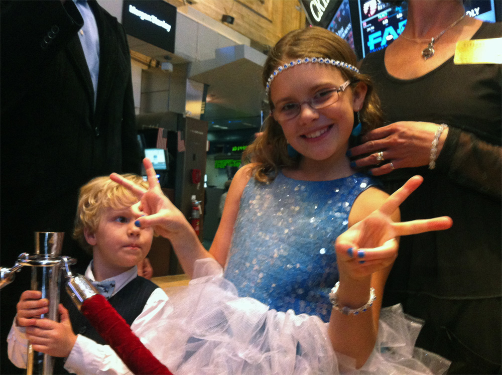 Vivienne Harr strikes a pose on the floor of the New York Stock Exchange