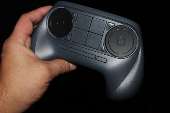 Valve's Steam Controller with trackpads that replace thumbsticks. It makes it possible to play PC games in the living room. #CES2014