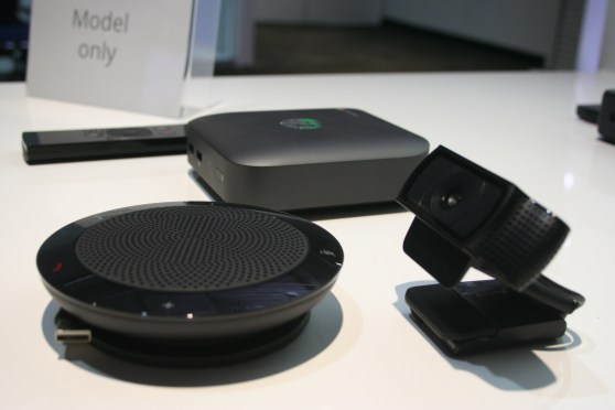 HP's version of the Chromebox for meetings, including a remote control, a speaker, a camera, and the box itself.