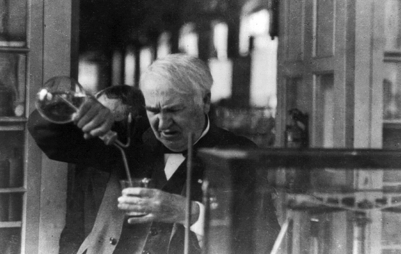 Thomas Edison experimenting in his laboratory.