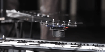 Watch 8 flying drones jam on keyboards, drums, and guitar