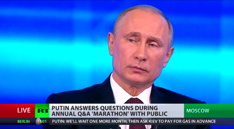 Vladimir Putin, listening yesterday to the translation of Edward Snowden's questions