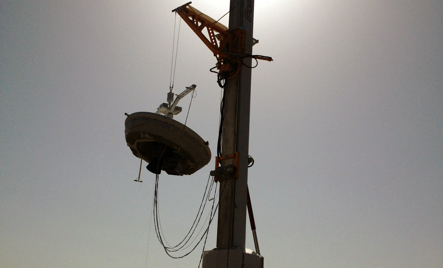 NASA's Low-Density Supersonic Decelerator craft on a crane at the U.S. Navy’s Pacific Missile Range Facility in Kauai, Hawaii.