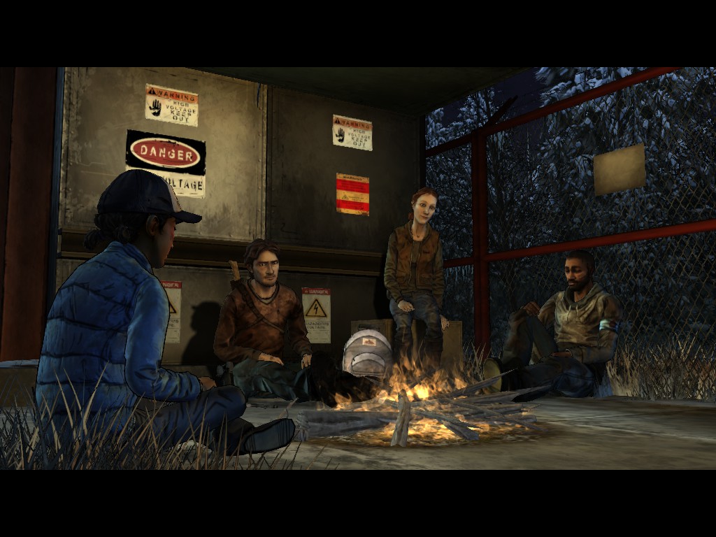 The group shares a quiet moment to trade jokes and stories in The Walking Dead Season Two Episode Five: No Going Back.