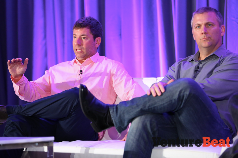 Peter Levin, left, president of interactive ventures and games at Lionsgate, speaks with Chris Petrovic, head of corporate development at Kabam, at VentureBeat's 2014 GamesBeat conference.