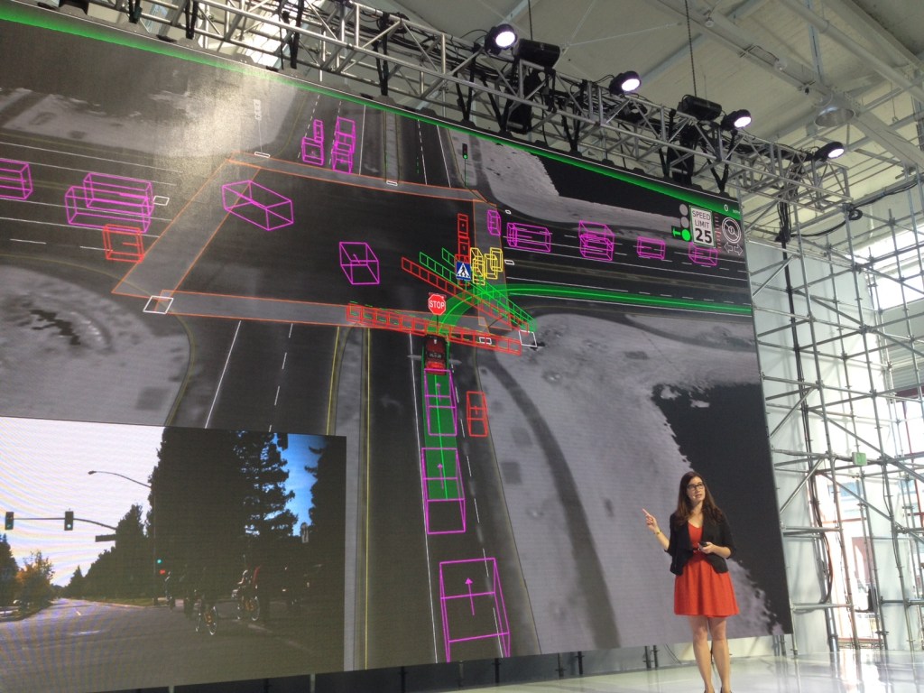 Arden shows how the Google cars brain sees other cars and pedestrians at an intersection.