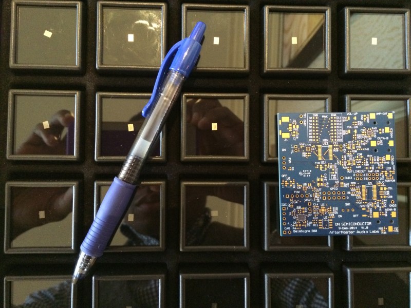 Pen and PCB board provide scale for a case full of AfterMaster's tiny DSP chips. 