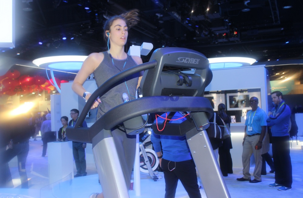 This woman at the Intel CES booth is wearing a Basis Peak smartwatch and SMS headphones. On day one of CES, she ran 11 miles.