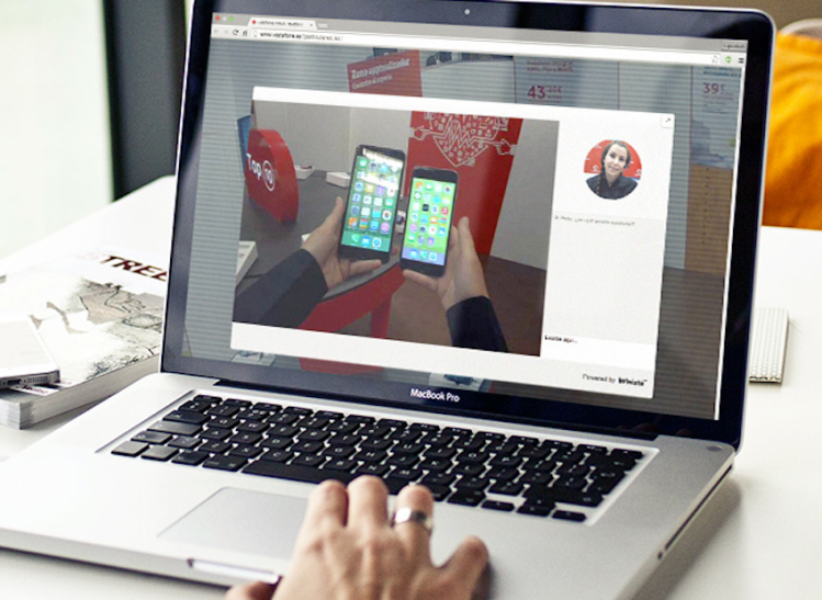 A remote sales rep presenting two smartphones via point-of-view video.