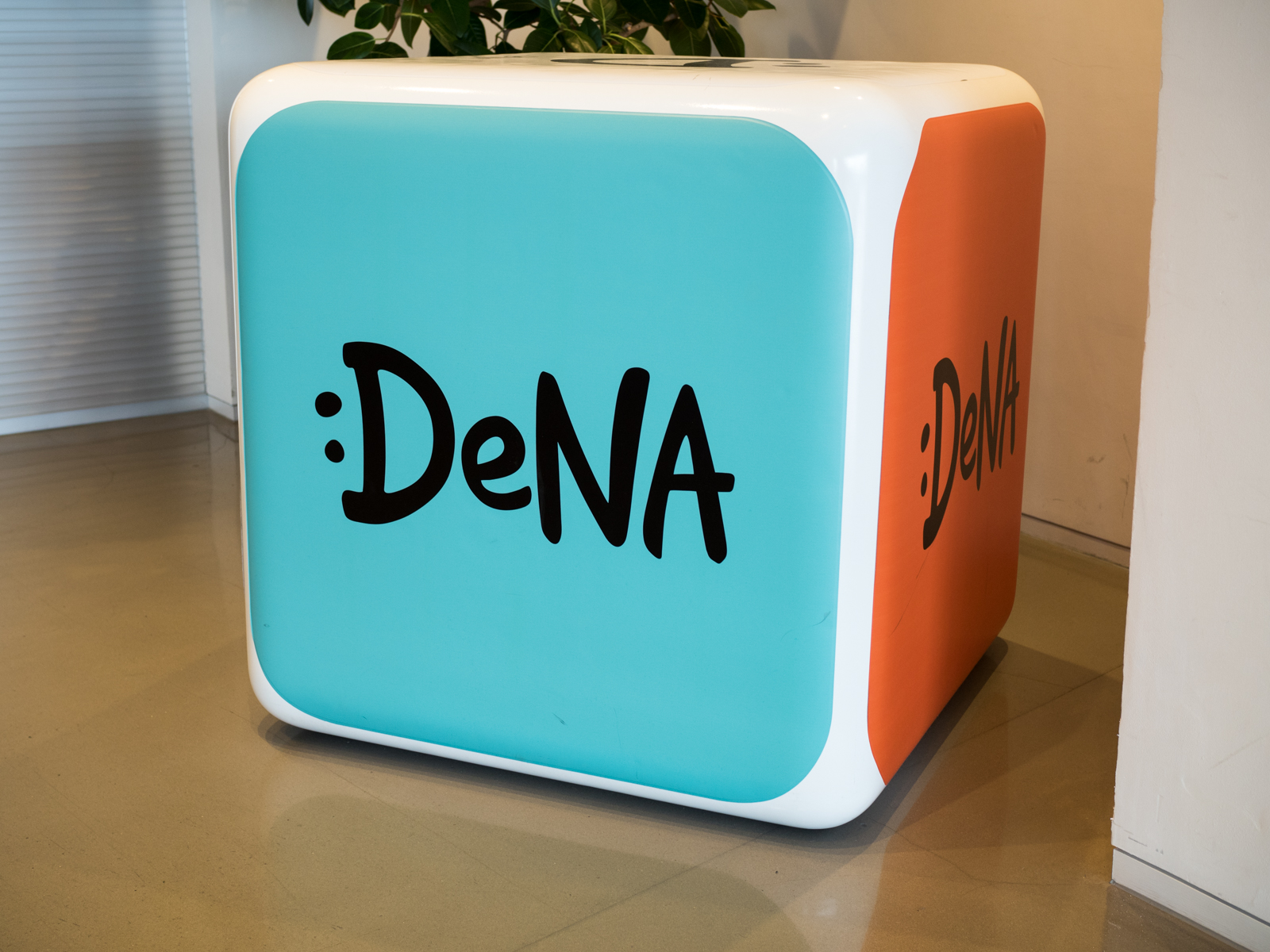 A colorful block featuring the DeNA logo.