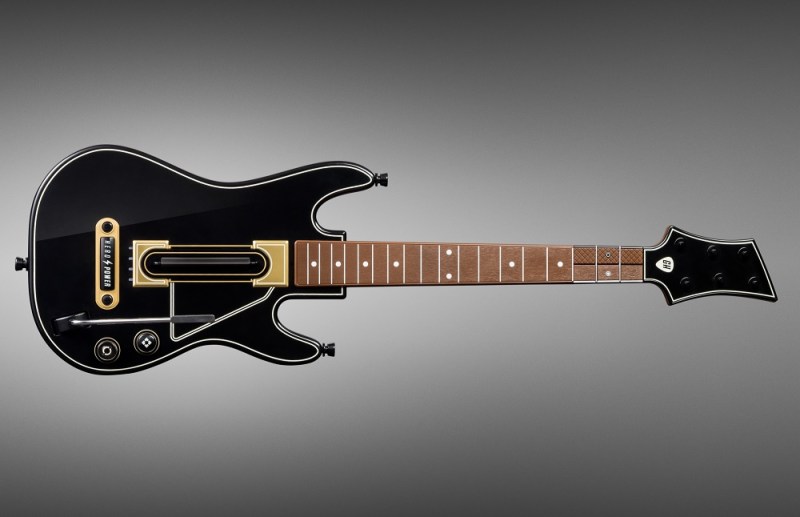 The new Guitar Hero controller has six buttons you can easily reach with your three middle fingers.