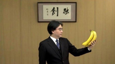 Iwata holds a bunch of bananas during a Nintendo Direct.