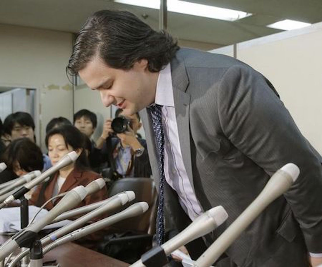 Mark Karpeles, chief executive of Mt. Gox, bows at the start of a news conference at the Tokyo District Court in Tokyo, in this photo taken by Kyodo February 28, 2014. REUTERS/Kyodo