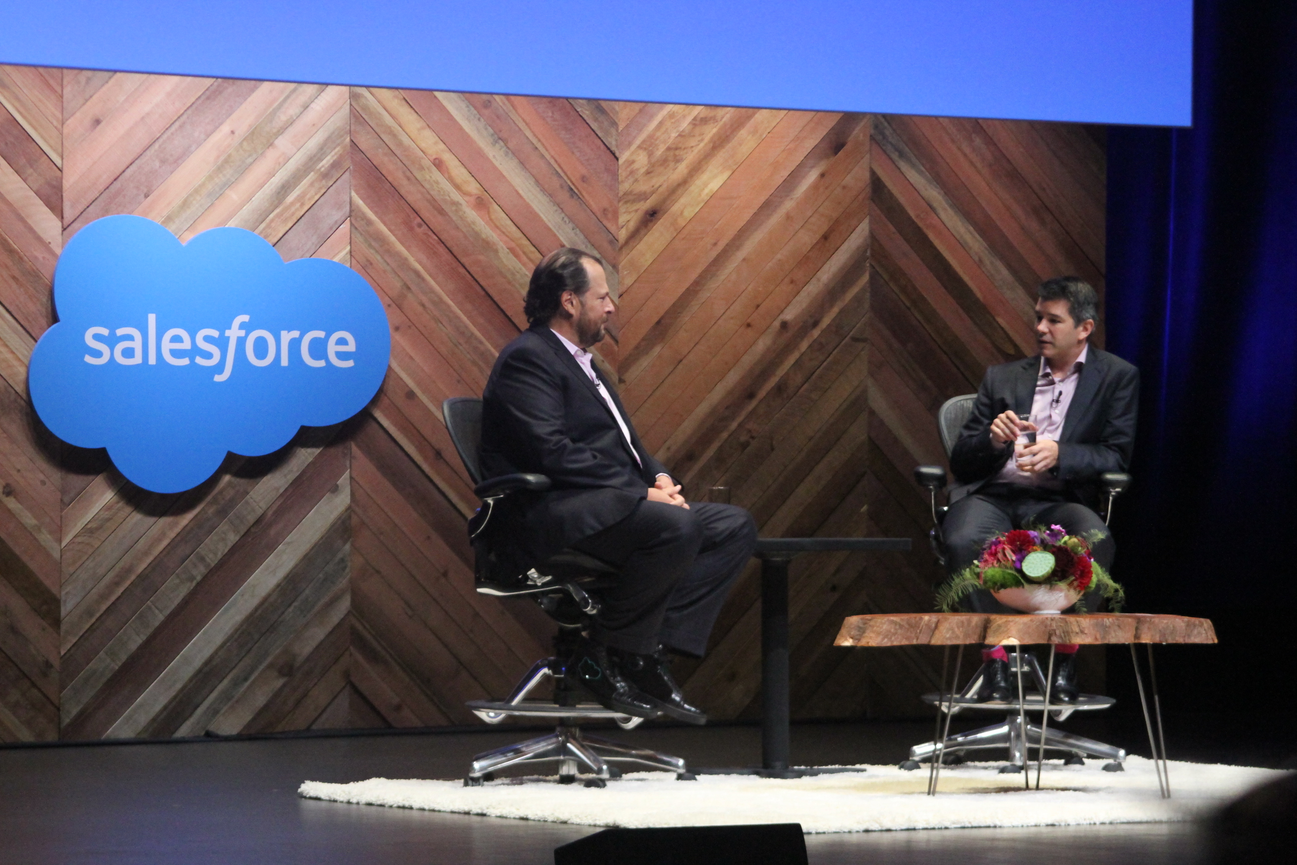 Salesforce CEO Marc Benioff and Uber CEO Travis Kalanick on stage during a fireside chat at Dreamforce 2015.