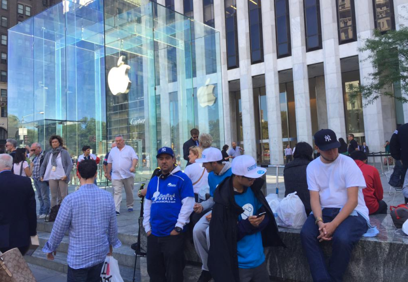 Apple fans line up at the "Church of Apple" in New York to buy an iPhone 6s Friday.