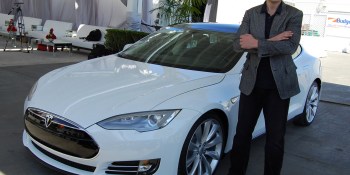 Tesla unveils autopilot system, but don’t let go of the wheel