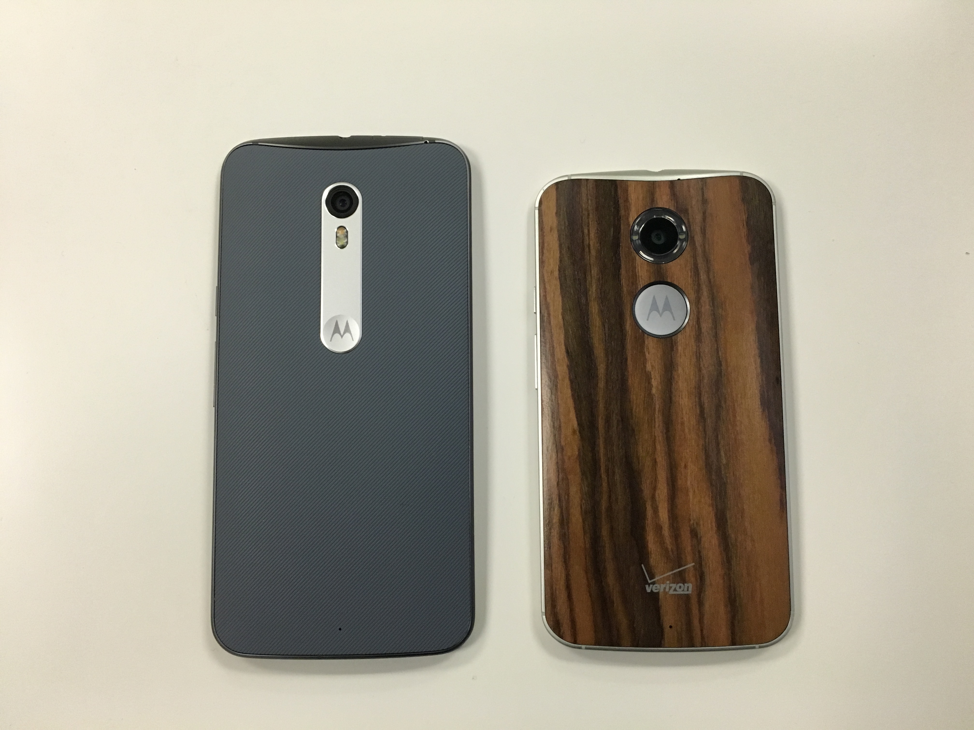 The back of the Moto X Pure Edition, left, next to the back of the Moto X (2nd Gen).