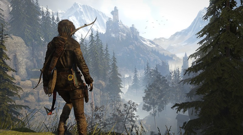 Lara Croft looks across a valley toward a distant goal in Rise of the Tomb Raider.