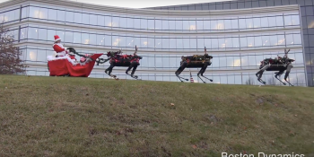 Watch a Boston Dynamics four-legged robot pull Santa in her sleigh