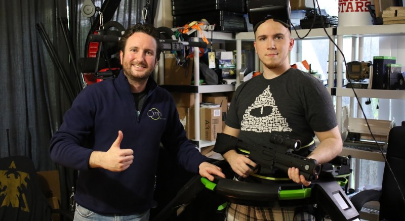 Jan Goetgeluk (left) of Virtuix with Fred Wood, Kickstarter supporter, on the Omni treadmill.