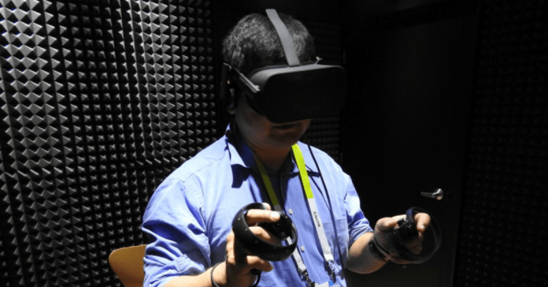 Dean Takahashi using the Oculus Rift VR headset with Oculus Touch.