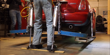 Watch this engineer use an exoskeleton to lift a Mini Cooper