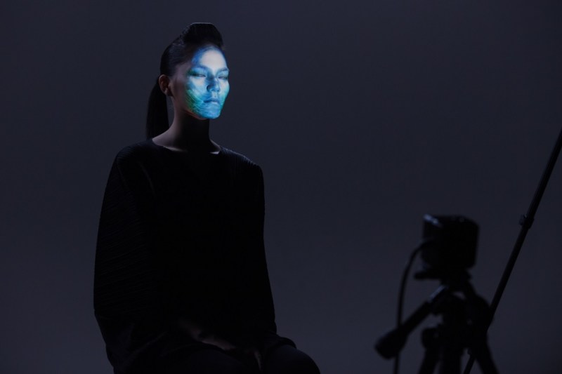 Intel projects colors on to a model's face in real-time.