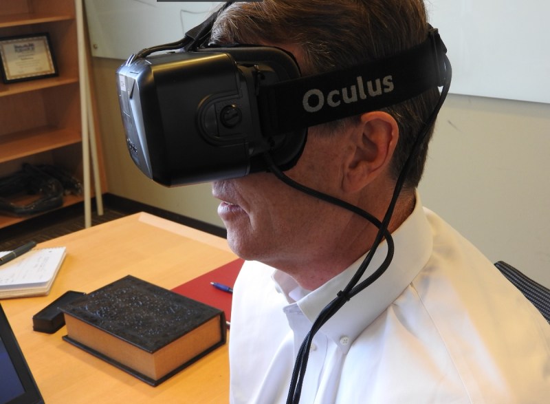 Eyefluence CEO Jim Marggraff wears an Oculus Rift VR headset.